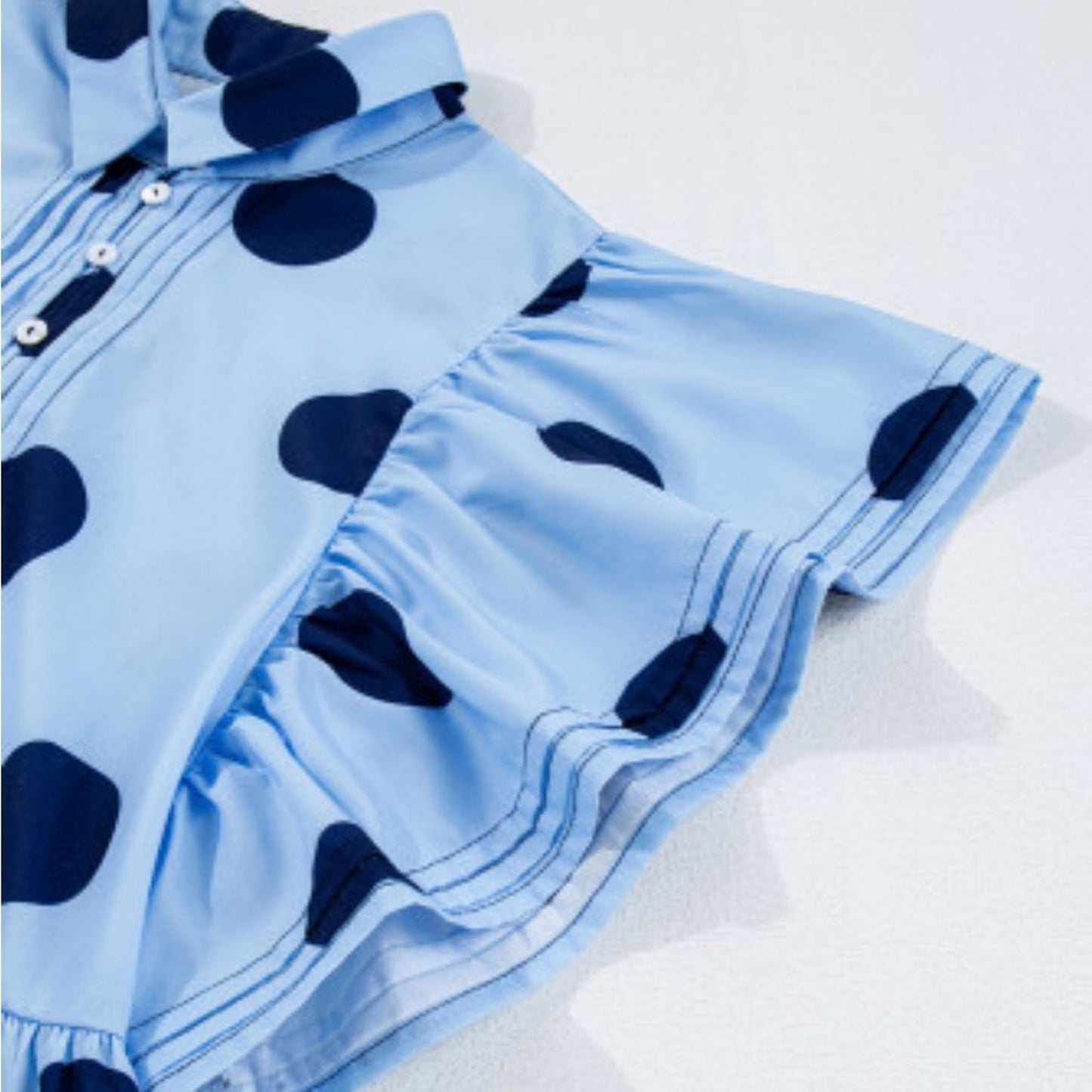 Hollie polka dot ruffled peplum top
